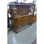 A 17th Century style carved oak court cupboard