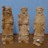 A set of three Vietnamese carved hardwood figures, three immortals