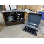 A cased Singer sewing machine and an Imperial typewriter