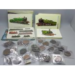 A collection of thirty coins and tokens including 19th Century and eighty-five locomotives postcards