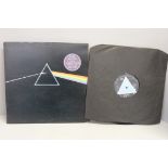 A Pink Floyd Dark Side of The Moon LP record, first pressing with "solid blue" prism, A2/B2