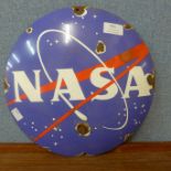 An enamelled circular NASA sign