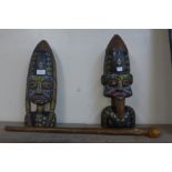 A pair of painted carved wooden African busts and a knobkerrie