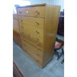 A teak chest of drawers