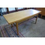 A Danish teak metamorphic dining/coffee table