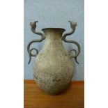 An Islamic brass two handled vase