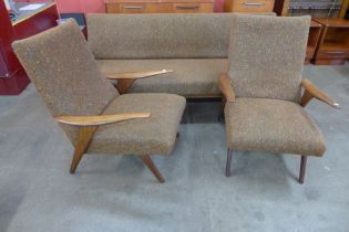 A Greaves & Thomas teak and fabric upholstered three piece lounge suite, comprising a sofa/daybed