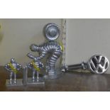 A painted cast iron Michelin Man tyres figure, a pair of book ends and a VW key rack