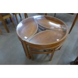 A Nathan Trinity teak and glass topped circular nest of tables