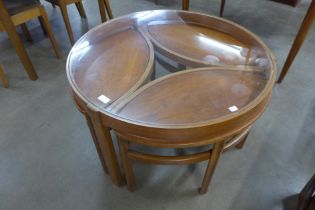 A Nathan Trinity teak and glass topped circular nest of tables