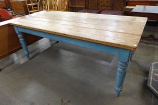 A large Victorian style painted pine scrub top farmhouse kitchen table