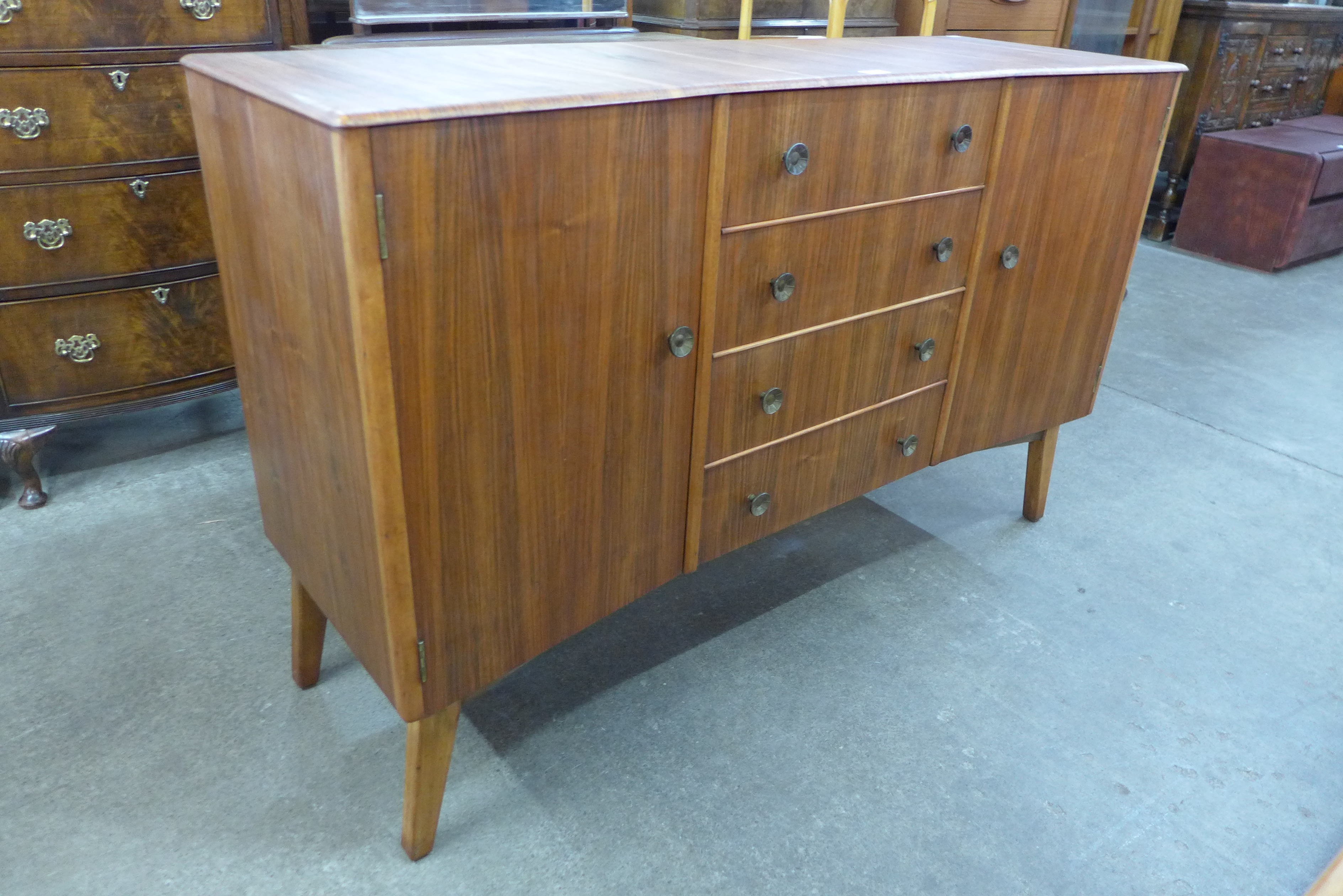 An afromosia concave sideboard