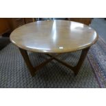 An Ercol Blonde ash circular coffee table