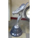 A large chrome effect Spirit of Ecstasy figure, on black marble socle