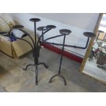 Two painted steel candle stands