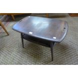 An Ercol Golden Dawn elm and beech Windsor tray top coffee table