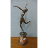 An Art Deco style bronze figure of a female dancer, on rouge marble socle