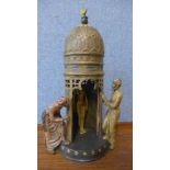 A Franz Bergman style painted bronze temple with door revealing a nude lady