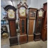 Three mahogany longcase clocks and an oak longcase longcase clock case