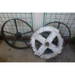 Three industrial cast iron wheels