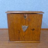 An early 20th Century oak smokers cabinet