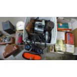 A Pentax ME Super 35mm SLR camera, a Russian camera, a pair of binoculars, a folding camera, light