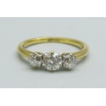 A 9ct gold and three stone diamond ring, approximately 0.90ct total diamond weight, 2.4g, L