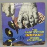 A Monty Python LP record signed by John Cleese, Eric Idle, Terry Jones, Terry Gilliam and Michael