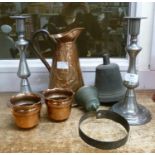 A Beldray Art Nouveau copper pitcher, a pair of copper cups, bronze bell, a shop bell and a pair