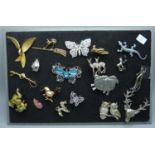 A collection of animal themed brooches