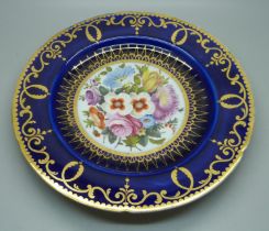 A circa 1830 royal blue cabinet plate with hand painted floral decoration, (some scratches and