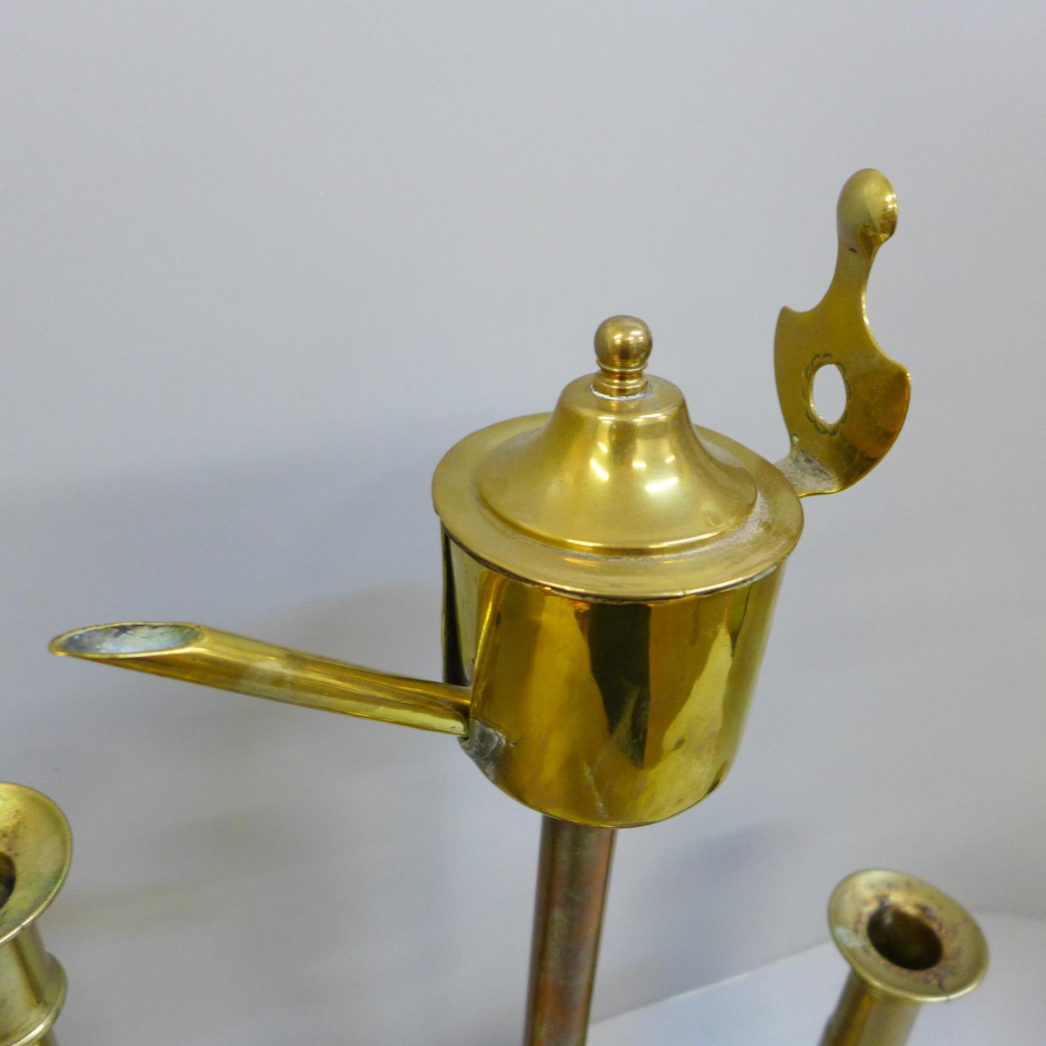 A Georgian brass whale oil lamp, a pair of gun barrel candlesticks and a tall single candlestick - Image 2 of 2