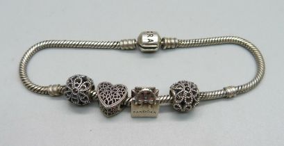 A Pandora bracelet and four Pandora charms