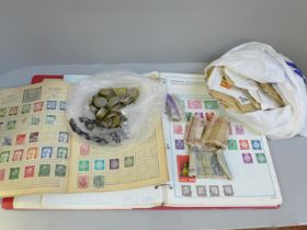 Two albums of postage stamps, loose stamps, foreign coins and bank notes