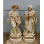 A pair of continental figures, Royal Dux style, 28cm