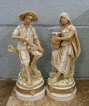 A pair of continental figures, Royal Dux style, 28cm