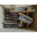 A box of wooden rebate planes and block planes