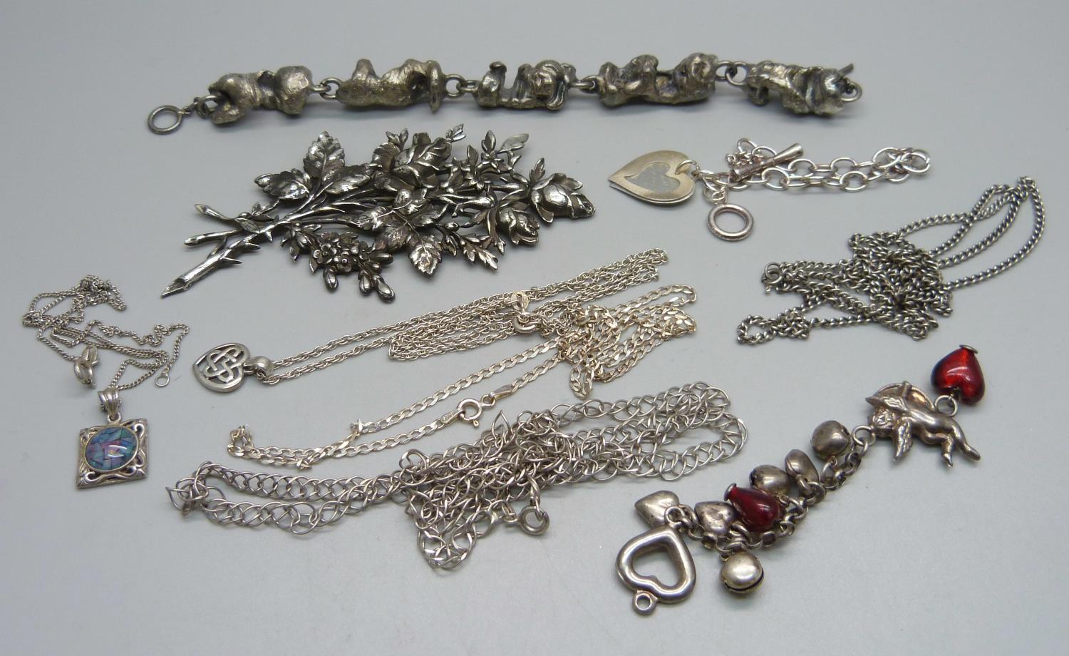 Five silver chains, two silver pendants, two bracelets, a large brooch marked 925 and a short