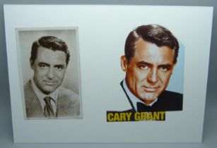 A Cary Grant autographed card and cutting