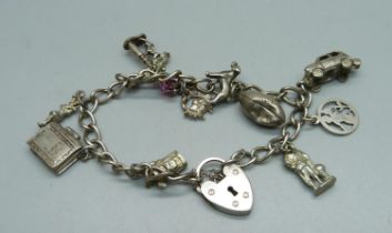 A silver charm bracelet, 28g