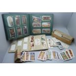 A collection of military themed cigarette cards and others