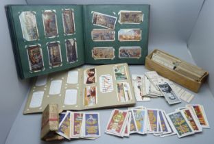 A collection of military themed cigarette cards and others