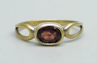 A silver gilt and garnet ring, N