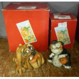 Two dog figures, both with Raya signature, boxed