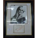 An Olivia Newton-John autographed display