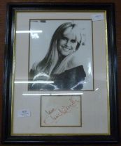 An Olivia Newton-John autographed display