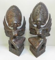 A pair of carved wooden Balinese figures