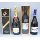 Four bottles of alcohol; Taylor's 10 Year Old Tawny, Remy Martin fine champagne, Moet & Chandon
