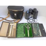 A drawing instrument set, a pair of silver handled grape scissors, a medical instrument and a pair