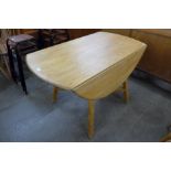 An Ercol Blonde elm and beech drop-leaf table